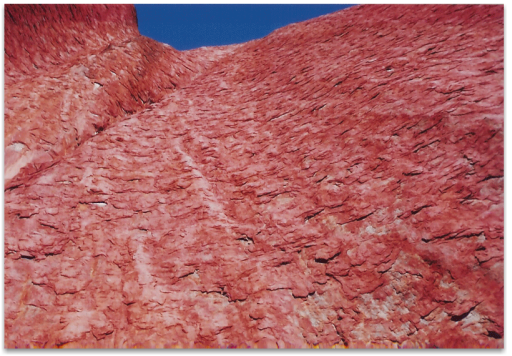 showing the surface flaking away on Uluru