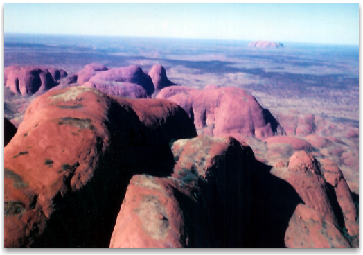 Kata Tjuta looking back from West to East to Uluru in the far distance-the ancient paleovalley exists in between